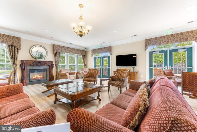 7315 Brookview Rd Unit 306, Elkridge, MD 21075 - living room featuring french doors, a chandelier, a premium fireplace, wood finished floors, and crown molding