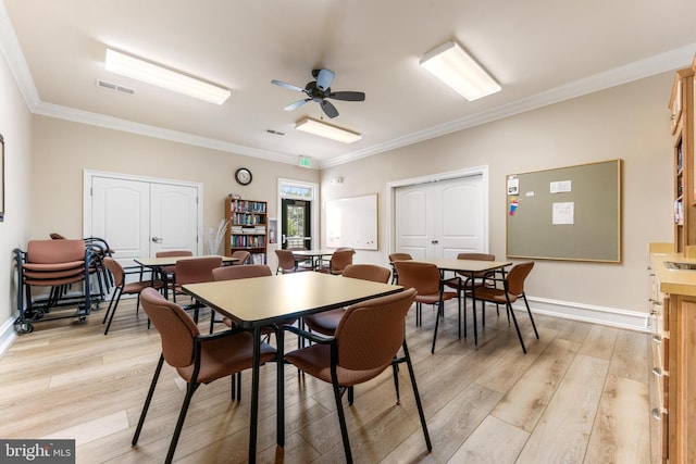 7315 Brookview Rd Unit 306, Elkridge, MD 21075 - dining room featuring light wood-style floors, crown molding, and a ceiling fan