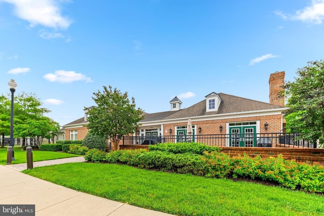 7315 Brookview Rd Unit 306, Elkridge, MD 21075 - view of front of home with brick siding, a front yard, and a chimney