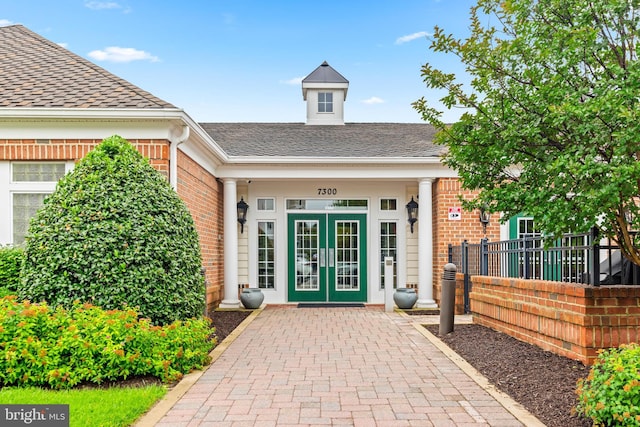 7315 Brookview Rd Unit 306, Elkridge, MD 21075 - doorway to property with french doors, brick siding, and roof with shingles