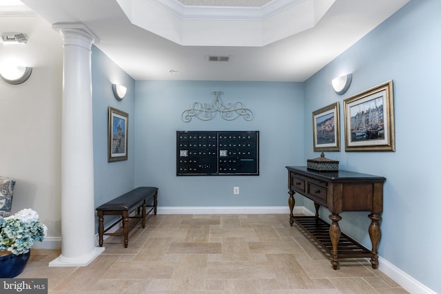 7315 Brookview Rd Unit 306, Elkridge, MD 21075 - hallway featuring mail area, decorative columns, and a raised ceiling