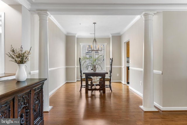 7315 Brookview Rd Unit 306, Elkridge, MD 21075 - dining area featuring wood finished floors, ornate columns, and crown molding