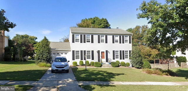 203 Watts Branch Pkwy, Rockville, MD 20850 - colonial house featuring an attached garage, driveway, and a front yard