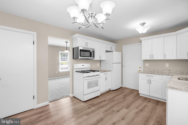 203 Watts Branch Pkwy, Rockville, MD 20850 - kitchen featuring white appliances, light wood-style floors, white cabinetry, a chandelier, and light stone countertops