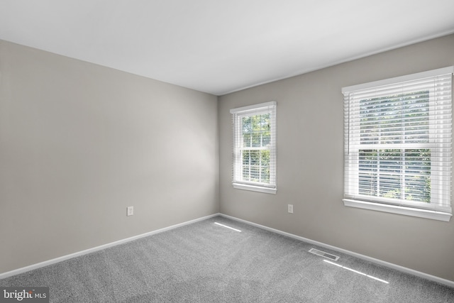 203 Watts Branch Pkwy, Rockville, MD 20850 - spare room featuring baseboards and carpet flooring