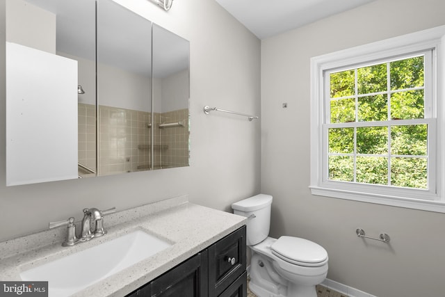 203 Watts Branch Pkwy, Rockville, MD 20850 - bathroom with vanity, healthy amount of natural light, and tiled shower