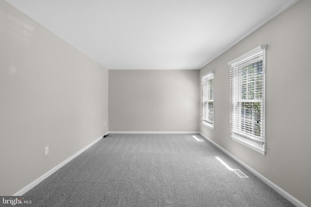 203 Watts Branch Pkwy, Rockville, MD 20850 - spare room featuring baseboards and carpet