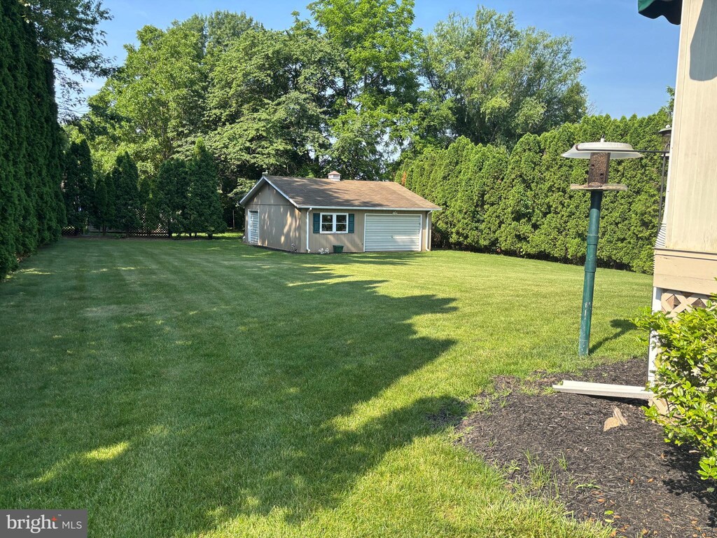 3332 Groton Ln, Dover, PA 17315 - view of green lawn with a detached garage and an outbuilding