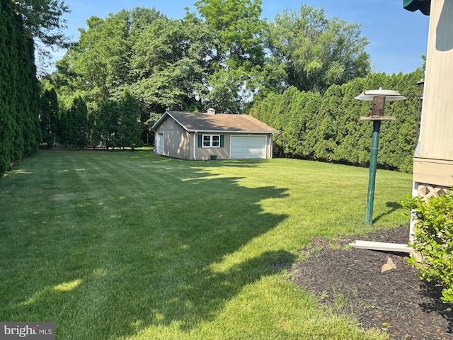 3332 Groton Ln, Dover, PA 17315 - view of green lawn with a detached garage and an outbuilding
