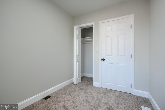 3027 Seamon Ave, Baltimore, MD 21225 - unfurnished bedroom featuring light colored carpet and a closet