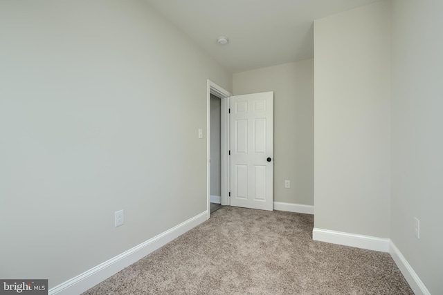 3027 Seamon Ave, Baltimore, MD 21225 - carpeted empty room with baseboards and a smoke detector