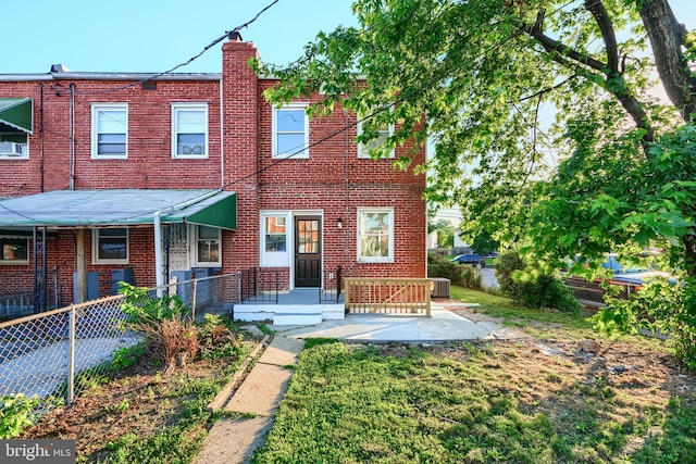 3027 Seamon Ave, Baltimore, MD 21225 - rear view of house with brick siding and a chimney