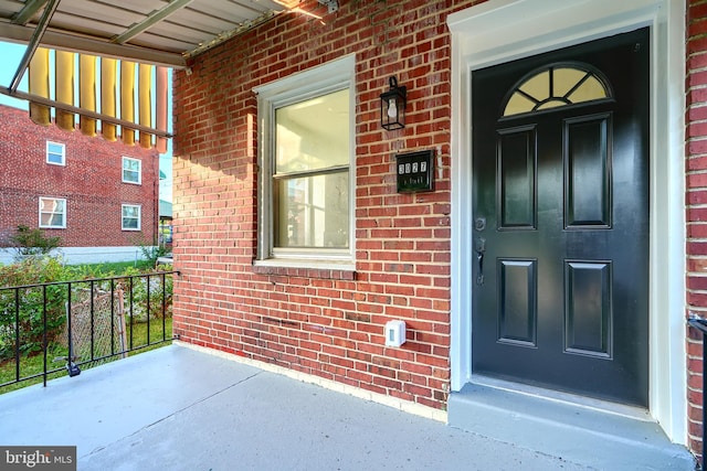3027 Seamon Ave, Baltimore, MD 21225 - entrance to property featuring brick siding and covered porch