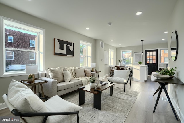 3027 Seamon Ave, Baltimore, MD 21225 - living area with light wood finished floors and recessed lighting