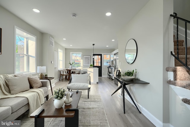 3027 Seamon Ave, Baltimore, MD 21225 - living area with stairway, recessed lighting, and light wood-type flooring