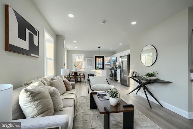 3027 Seamon Ave, Baltimore, MD 21225 - living area with recessed lighting and light wood-style floors