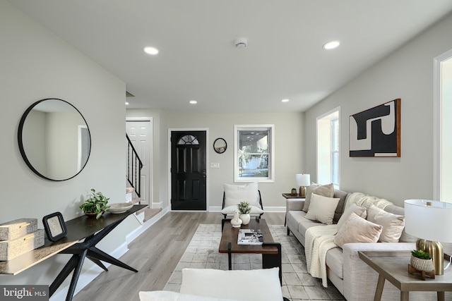 3027 Seamon Ave, Baltimore, MD 21225 - living area with stairs, recessed lighting, and light wood-style floors