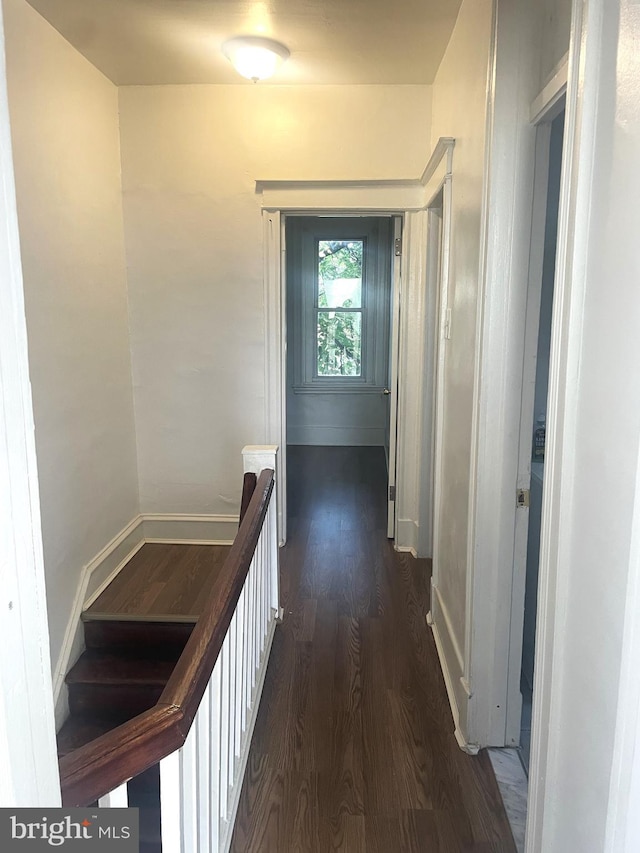 1921 S Ithan St, Philadelphia, PA 19143 - hallway featuring dark wood-style flooring and an upstairs landing
