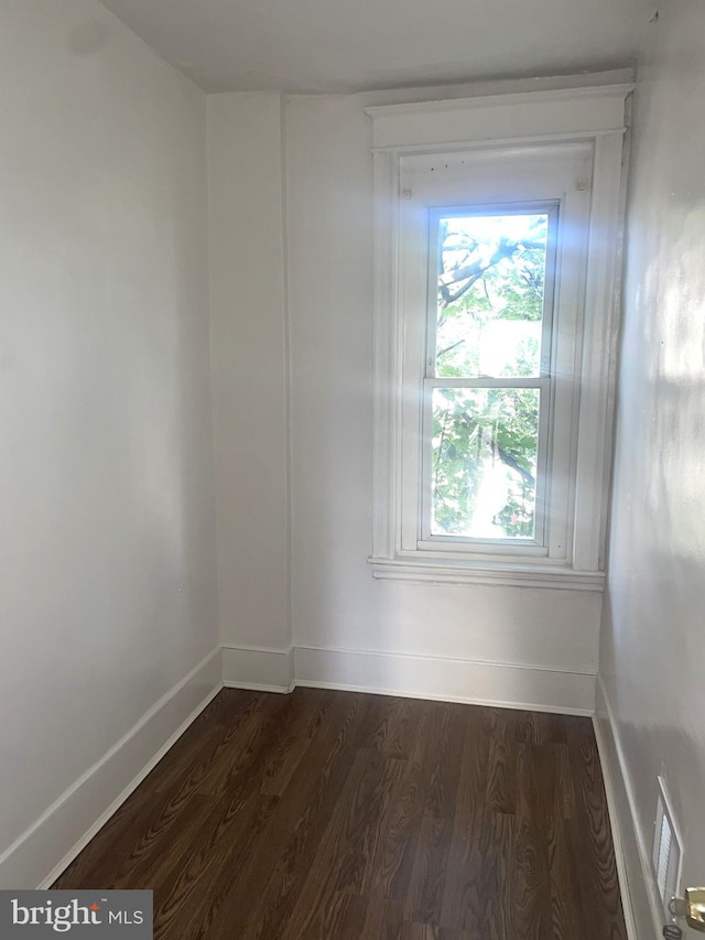 1921 S Ithan St, Philadelphia, PA 19143 - empty room with dark wood-style flooring and baseboards