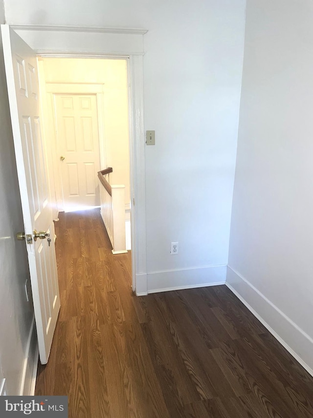 1921 S Ithan St, Philadelphia, PA 19143 - hallway with dark wood-type flooring and an upstairs landing