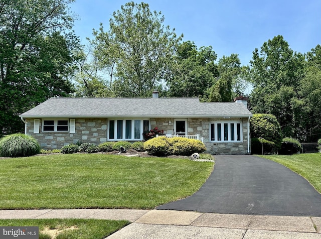 18 Linda Ln, Hatboro, PA 19040 - ranch-style home with stone siding, a chimney, a front yard, and roof with shingles
