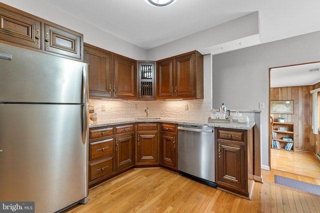 18 Linda Ln, Hatboro, PA 19040 - kitchen with stainless steel appliances, light wood-style flooring, decorative backsplash, and light stone counters