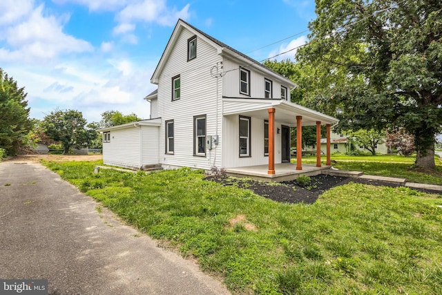 33 Main St, Pilesgrove, NJ 08098 - view of front facade featuring covered porch and a front lawn