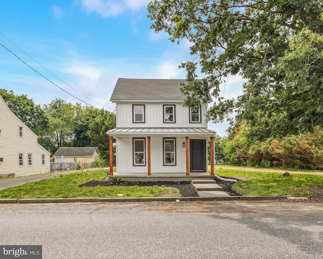 33 Main St, Pilesgrove, NJ 08098 - modern farmhouse featuring a standing seam roof, covered porch, a metal roof, and a front lawn