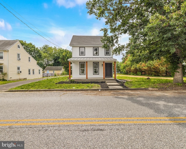 33 Main St, Pilesgrove, NJ 08098 - modern farmhouse featuring board and batten siding, a standing seam roof, a porch, a metal roof, and roof with shingles
