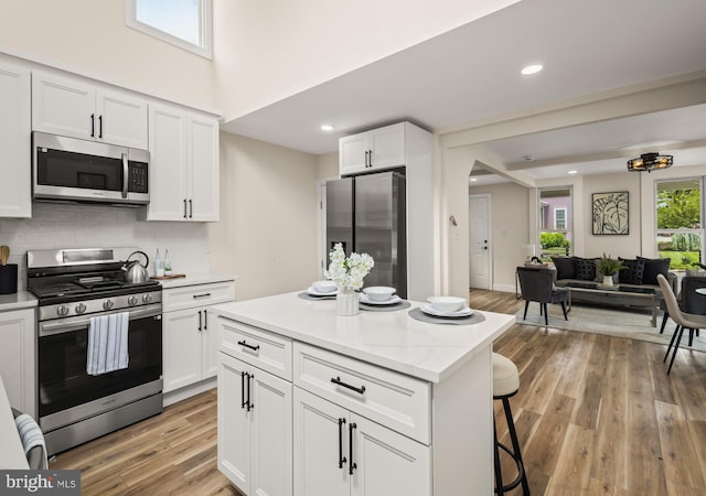 33 Main St, Pilesgrove, NJ 08098 - kitchen with appliances with stainless steel finishes, white cabinets, decorative backsplash, and recessed lighting