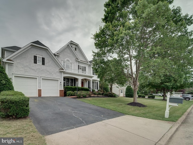 8429 Link Hills Loop, Gainesville, VA 20155 - view of front of property with asphalt driveway, an attached garage, and a front yard