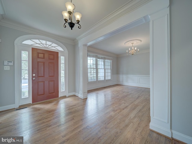 8429 Link Hills Loop, Gainesville, VA 20155 - entryway featuring a chandelier, wood finished floors, and ornamental molding