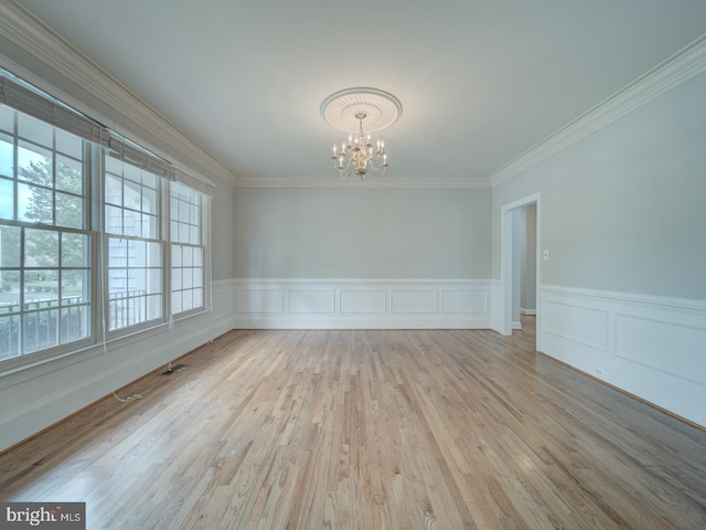 8429 Link Hills Loop, Gainesville, VA 20155 - unfurnished room featuring a chandelier, crown molding, wood finished floors, and a wainscoted wall