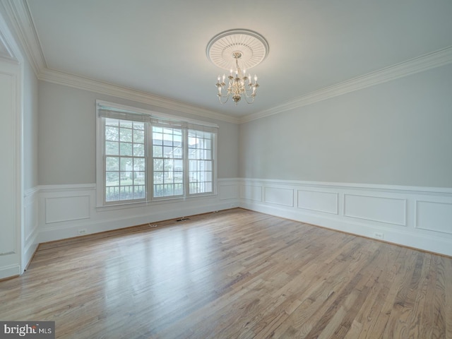 8429 Link Hills Loop, Gainesville, VA 20155 - unfurnished room featuring a chandelier, a wainscoted wall, crown molding, and wood finished floors