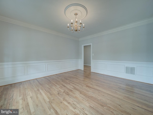 8429 Link Hills Loop, Gainesville, VA 20155 - unfurnished room featuring a chandelier, crown molding, a wainscoted wall, and wood finished floors