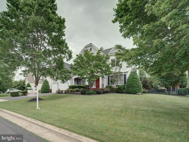 8429 Link Hills Loop, Gainesville, VA 20155 - view of property hidden behind natural elements with asphalt driveway and an attached garage