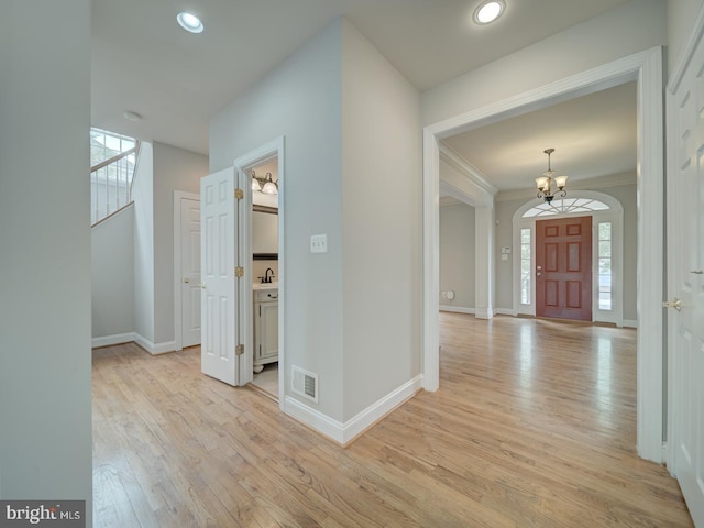 8429 Link Hills Loop, Gainesville, VA 20155 - entryway featuring a chandelier, light wood finished floors, recessed lighting, and ornamental molding