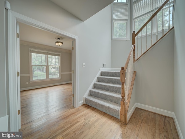 8429 Link Hills Loop, Gainesville, VA 20155 - stairway featuring healthy amount of natural light and wood finished floors