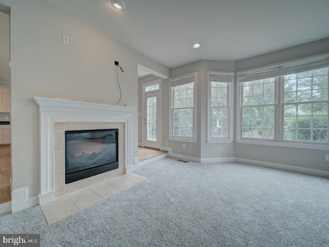 8429 Link Hills Loop, Gainesville, VA 20155 - unfurnished living room featuring carpet flooring, a tile fireplace, and recessed lighting