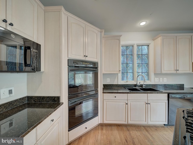 8429 Link Hills Loop, Gainesville, VA 20155 - kitchen featuring black appliances, dark stone counters, light wood finished floors, and recessed lighting