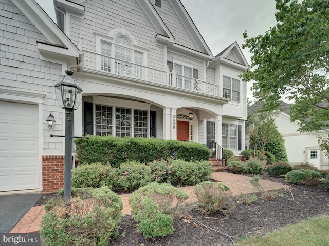 8429 Link Hills Loop, Gainesville, VA 20155 - view of front of property with a balcony and a garage