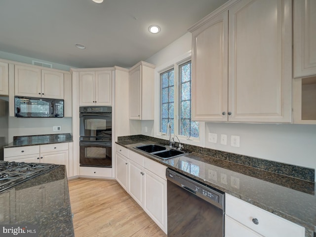 8429 Link Hills Loop, Gainesville, VA 20155 - kitchen featuring black appliances, dark stone counters, light wood finished floors, and recessed lighting