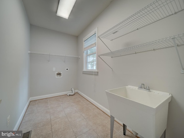 8429 Link Hills Loop, Gainesville, VA 20155 - washroom with hookup for an electric dryer, washer hookup, and light tile patterned floors