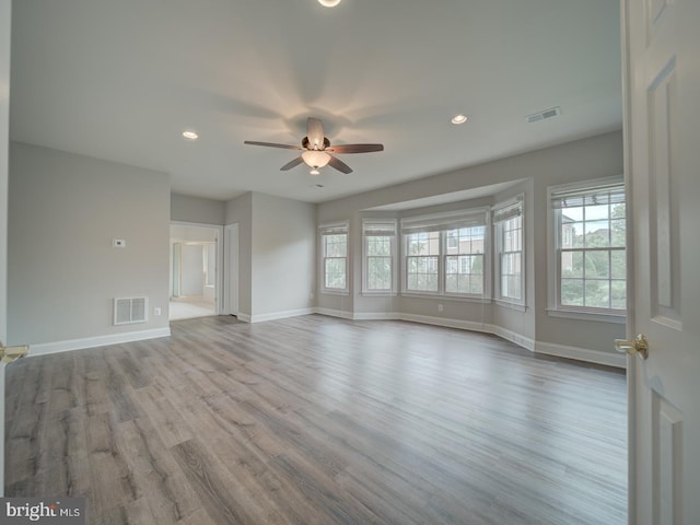 8429 Link Hills Loop, Gainesville, VA 20155 - unfurnished living room with plenty of natural light, ceiling fan, wood finished floors, and recessed lighting
