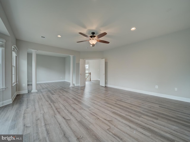 8429 Link Hills Loop, Gainesville, VA 20155 - empty room featuring a ceiling fan, wood finished floors, recessed lighting, and decorative columns