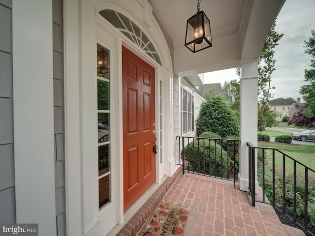 8429 Link Hills Loop, Gainesville, VA 20155 - doorway to property featuring a porch