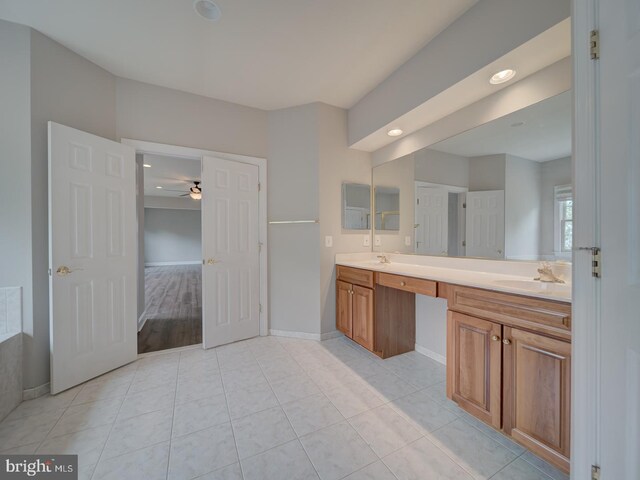 8429 Link Hills Loop, Gainesville, VA 20155 - bathroom with double vanity, recessed lighting, ceiling fan, and tile patterned floors