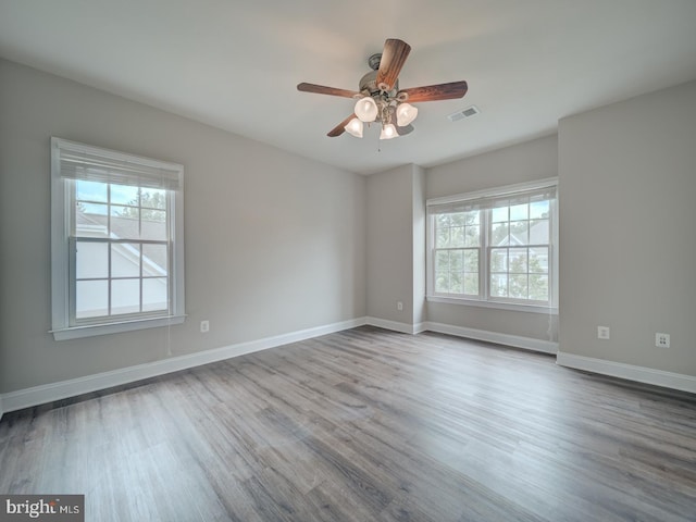 8429 Link Hills Loop, Gainesville, VA 20155 - empty room featuring plenty of natural light, wood finished floors, and ceiling fan