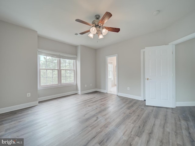 8429 Link Hills Loop, Gainesville, VA 20155 - unfurnished bedroom featuring wood finished floors, ceiling fan, and ensuite bathroom