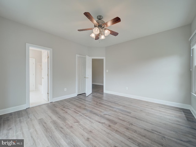 8429 Link Hills Loop, Gainesville, VA 20155 - unfurnished bedroom with wood finished floors, ceiling fan, and ensuite bathroom